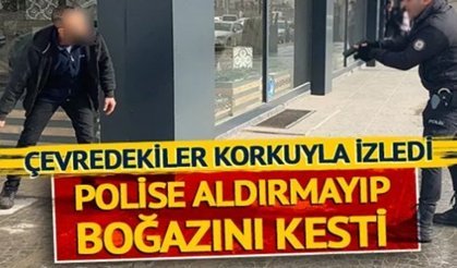 Çevredekiler korkuyla izledi, polise aldırmayıp boğazını kesti